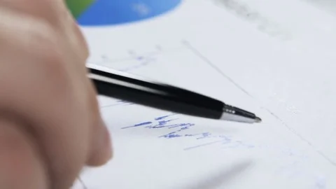 Close up of a man studying a graph Stock-Footage 74296687