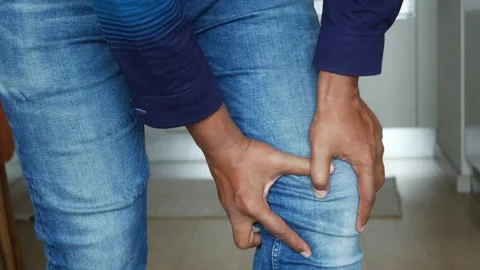 Close up on man suffering knee joint pain Stock Footage 254533415