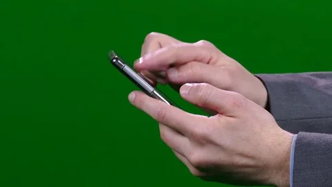 Close up of Man in Suit Using a Mobile Phone Green Screen Stock Footage 83734422