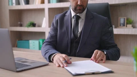 Close-up of a man in a suit, worker brought documents, a report for signature Stock Footage 233994457