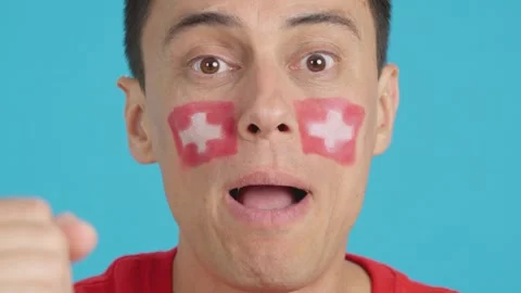 Close up of a man supporting swiss team Stock Footage 274442048