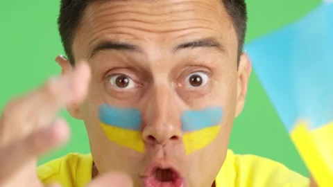 Close up of a man supporting ukrainian team Stock Footage 254964715