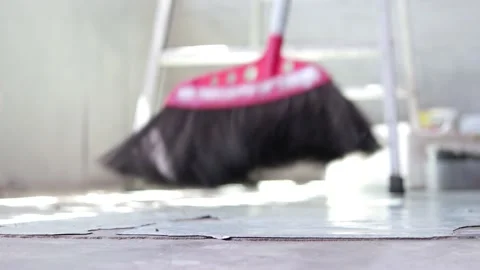 Close up of a man sweeping floor with a broom, home cleaning Video stock 146764758