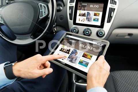 Close up of man with tablet pc in car Stock Photos