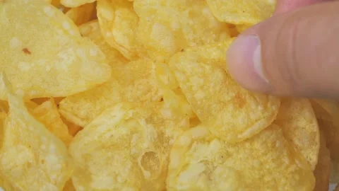 Close up. the man takes the chips Stock Footage 218397173