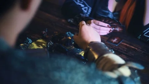 Close up of man taking dragon figure from fantasy board game Stock Footage 79441834