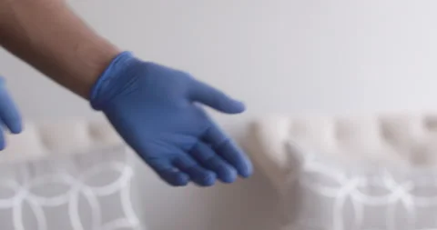 Close up of man taking gloves off 動画素材 130673019