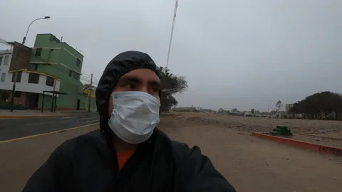 Close up of a man taking off his mask to breathe while running Stock Footage 140562499