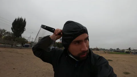 Close up of a man taking off his mask, face shield and romper while running Vidéo 141655419