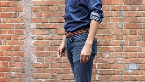 Close up of a man taking out his smartphone frome jean pocket, daytime, outdo Video stock 150342125