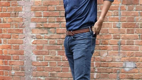 Close up of a man taking out his smartphone frome jean pocket, daytime, outdo Video stock 150342127