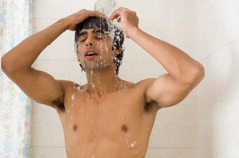 Close-up of a man taking a shower Fotos Stock