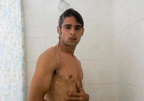 Close-up of a man taking a shower Fotos Stock