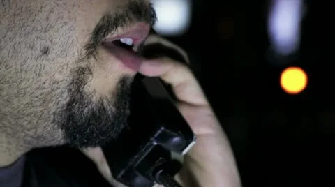 Close-up man talking over the phone Stock Footage 12695241