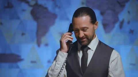Close-up of a man talking on the phone, receptionist, manager, administrator Video stock 233717728