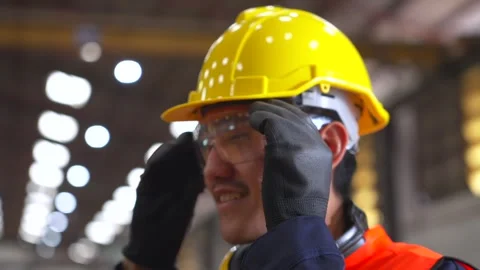 Close up man technician engineer wearing and adjust protective safety glasses. Stock Footage 332119427