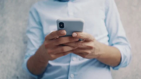 Close up of man texting on smartphone Stock Footage 112868991