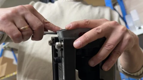 Close up of man tightening bolt on coffee machine brewing unit, maintenance and Stock Footage 337110546