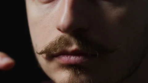 Close up of a man touching his mustache Stock-Footage 99749055
