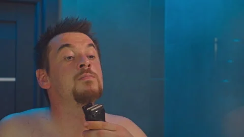 Close Up of a Man Trimming His Beard in the Bathroom at Home Male Grooming 스톡 동영상 289728319