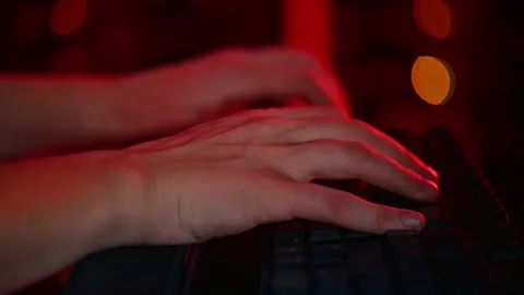 Close up of a man trying to fix an error on a computer in a server room Stock Footage 287370555