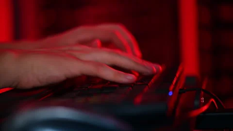 Close up of a man trying to fix an error on a computer in a server room Stock Footage 287370607