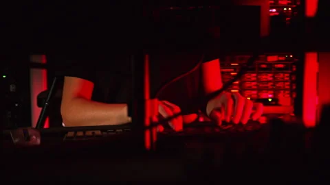 Close up of a man trying to fix an error on a computer in a server room Stock Footage 287406012