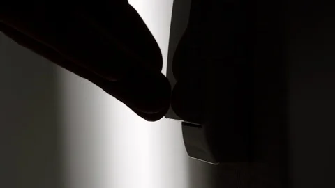 CLOSE UP: Man turning on the light with a switch on the wall Stock Footage 102443564