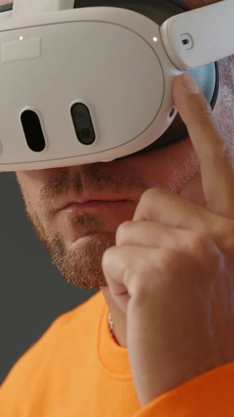 Close-up of man turning on VR goggles. Push button on virtual reality headset. Stock Footage 267124733