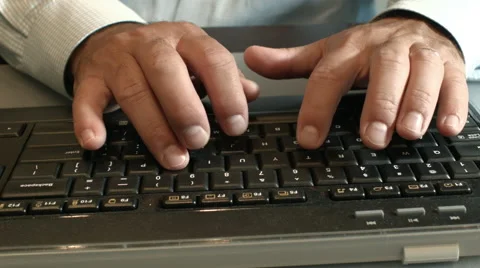 Close up of man typing on a computer keyboard Stock Footage 68197370