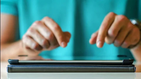 Close-Up Man Typing on IPad on Virtual Keyboard, Time Lapse Stock Footage
