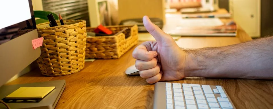 Close-up of a man typing on the keyboard of computer in the evening in the ho Stock Photos