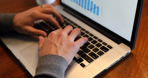 Close-up of man typing on laptop keyboard while working indoors Stock Footage 120084728