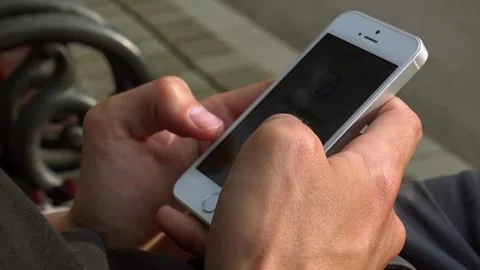 Close-Up of a Man Typing on a Mobile Phone Stock Footage 305238221