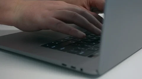 Close up man typing on modern notebook / laptop computer keyboard Stock Footage 95552296