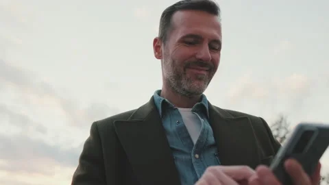 Close-up of man uses mobile phone Stock Footage 227135259