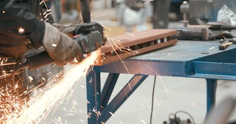 Close up on man using angle grinder Stock Footage 103774646