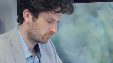 Close-up of man using an app on the tablet on a train journey Video stock 67259138