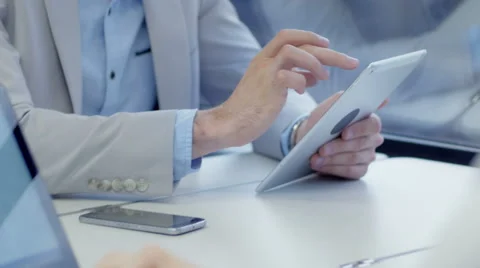 Close-up of man using an app on the tablet on a train journey Stock Footage 67259312