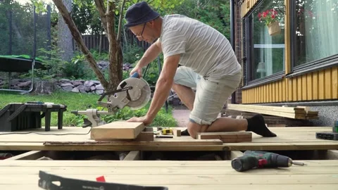 Close-up of a man using a circular saw Stock Footage 307384579