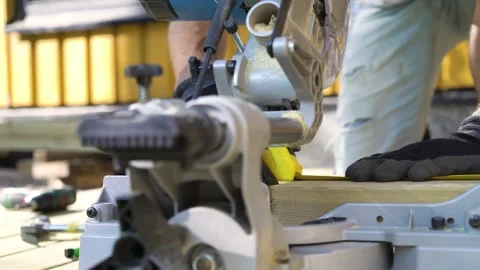 Close-up of a man using a circular saw Stock Footage 307385844