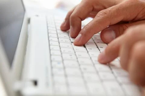 Close up man using computer keyboard 写真素材