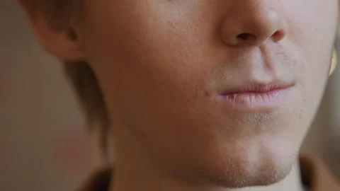 Close up of man using dental floss to clean mouth and remove food particles in Stock Footage 344868024