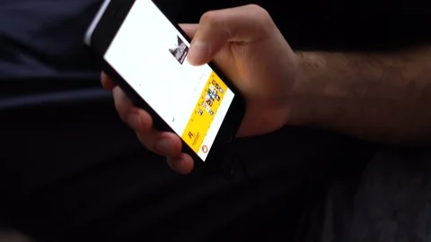 Close-up of a man using his smartphone browsing social media Stock Footage 88255731
