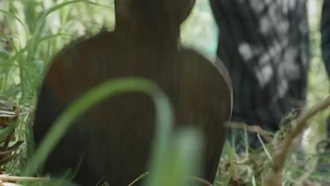 Close up of a man using an hoe on field. Tilling soil, tilling vegetable garden. Video stock 139345161
