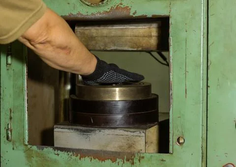 Close up of a man using a machine Stock Photos