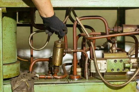 Close up of a man using a machine Stock Photos
