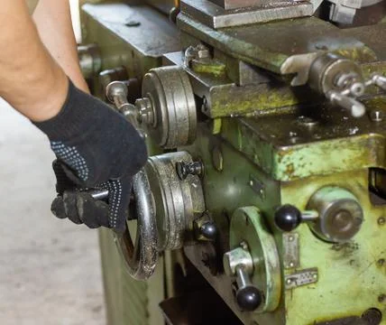 Close up of a man using a machine Фото