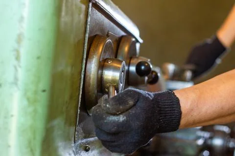 Close up of a man using a machine Stock Photos