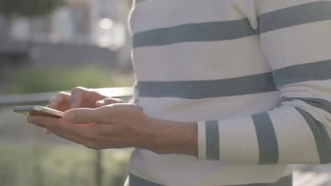 Close up of man using mobile phone, outdoor. 動画素材 70059020